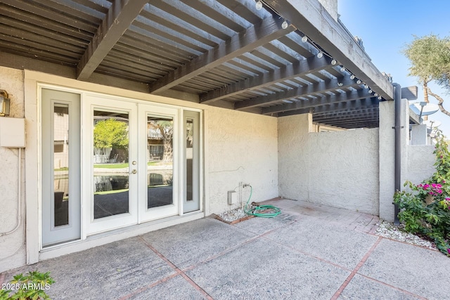 view of patio featuring french doors and a pergola