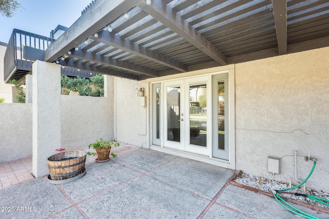 view of patio / terrace with french doors and a pergola