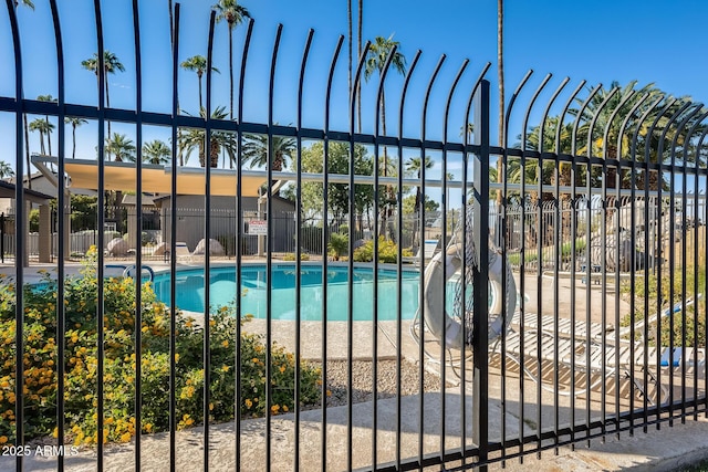 community pool featuring fence