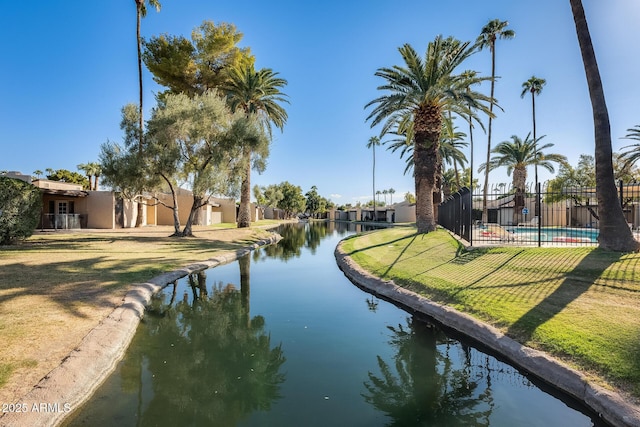 view of water feature with fence