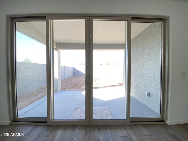 entryway with french doors and wood finished floors