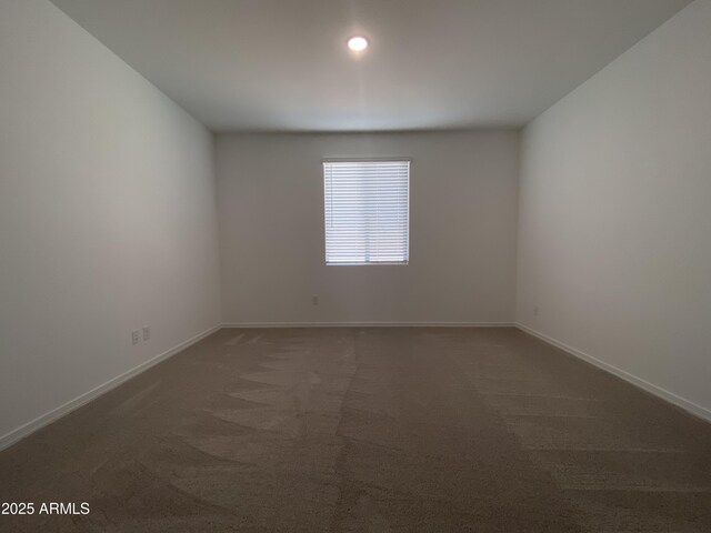 spare room with carpet, baseboards, and recessed lighting