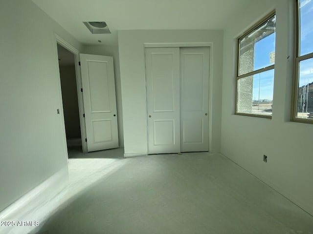 unfurnished bedroom with a closet