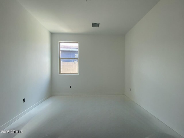 spare room with concrete floors