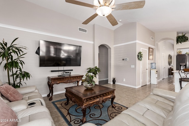 tiled living room with high vaulted ceiling and ceiling fan