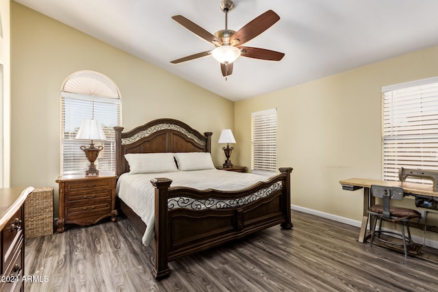 bedroom with ceiling fan and dark hardwood / wood-style flooring