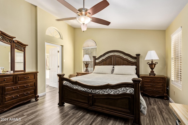 bedroom with dark hardwood / wood-style floors, ceiling fan, and lofted ceiling