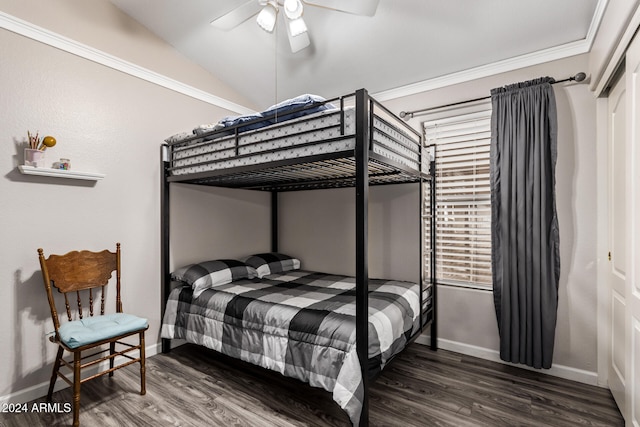 bedroom featuring ceiling fan, ornamental molding, dark wood-type flooring, and a closet