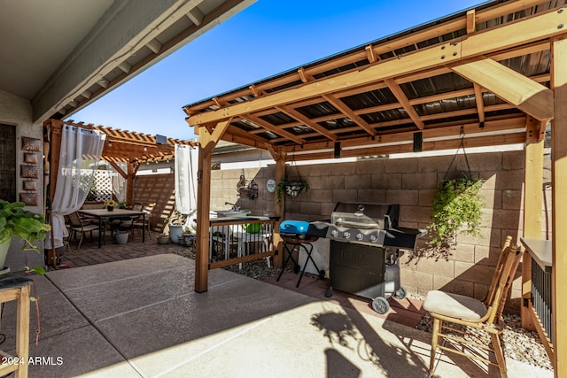 view of patio / terrace featuring a pergola and a grill