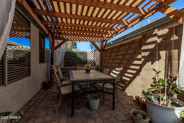 view of patio featuring a pergola