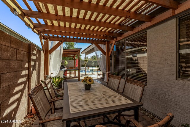 view of patio / terrace with a pergola and a community pool