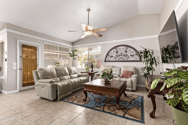 living room featuring ceiling fan, lofted ceiling, and light tile patterned flooring