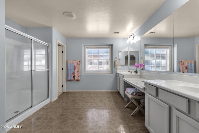 3863 S Posse Trl, Gilbert, AZ 85297 - full bath featuring double vanity, a stall shower, and tile patterned floors