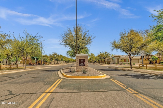 3863 S Posse Trl, Gilbert, AZ 85297 - view of asphalt street with sidewalks, curbs, and traffic signs