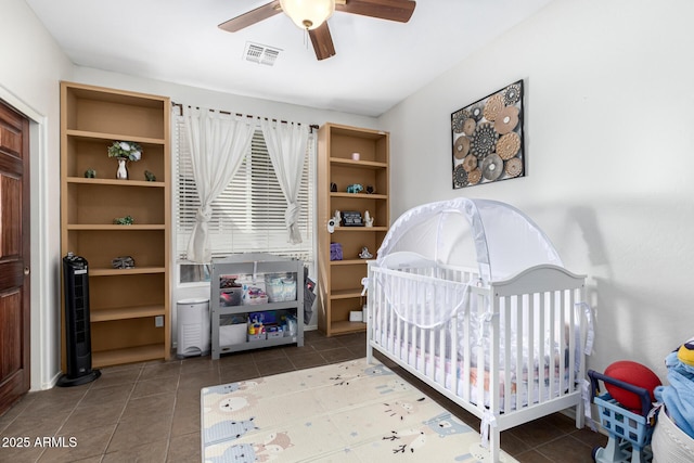 bedroom featuring ceiling fan, tile patterned flooring, and visible vents