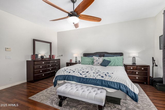 bedroom with ceiling fan, baseboards, and wood finished floors