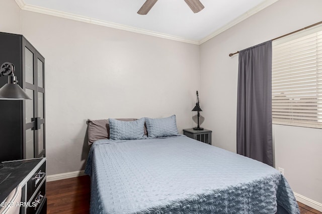 bedroom featuring baseboards, ceiling fan, dark wood-style flooring, and crown molding