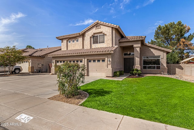 view of front facade with a garage, fence, concrete driveway, stucco siding, and a front lawn