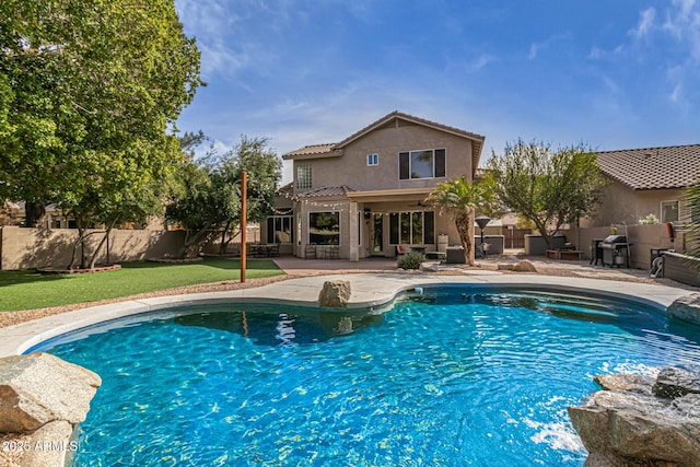 view of pool featuring a fenced in pool, a patio area, a fenced backyard, and a grill