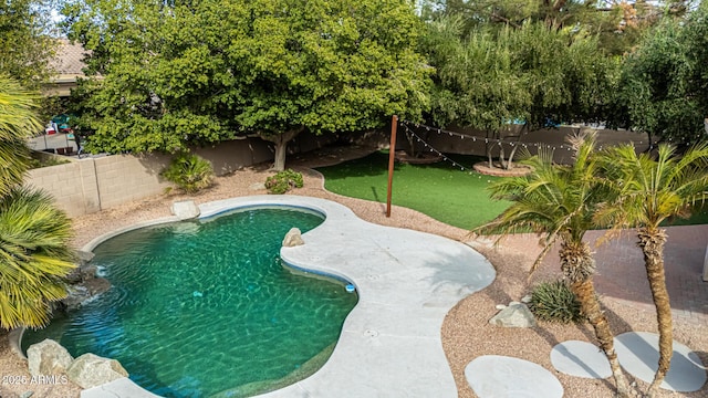 view of pool featuring a fenced backyard and a fenced in pool