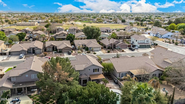 birds eye view of property with a residential view