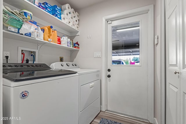 washroom featuring wood-type flooring and washer and clothes dryer