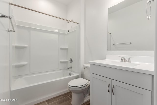 full bathroom with washtub / shower combination, vanity, and toilet