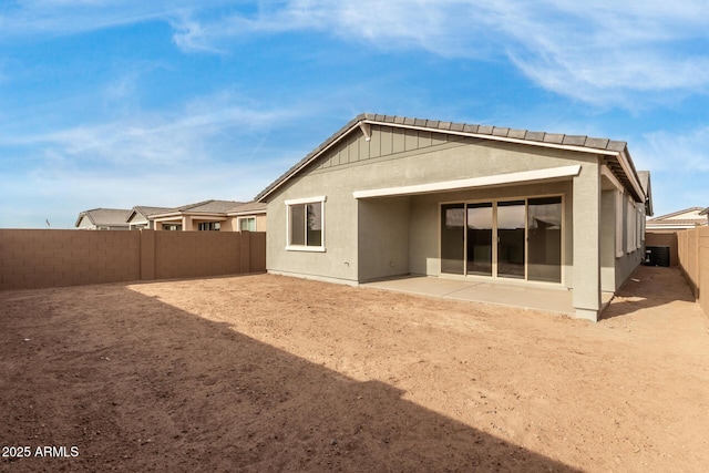 back of house with a patio