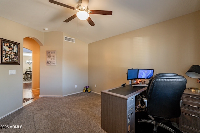 carpeted office with ceiling fan with notable chandelier and lofted ceiling