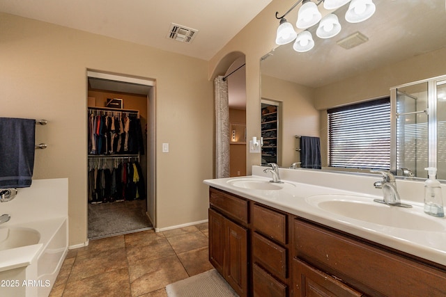 bathroom featuring a tub and vanity