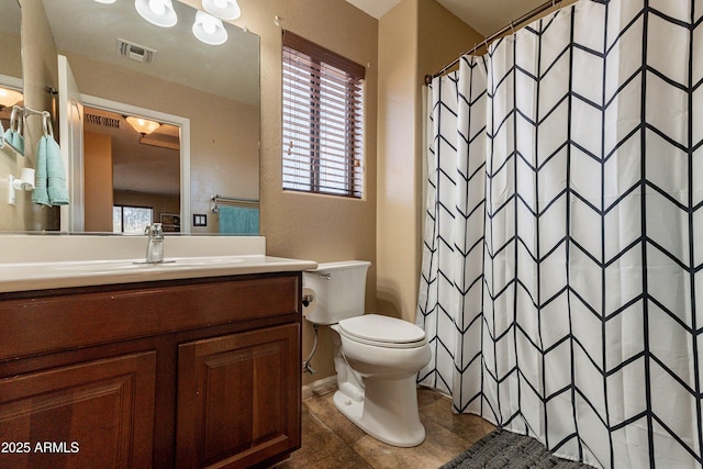 bathroom featuring tile patterned flooring, vanity, toilet, and a shower with curtain