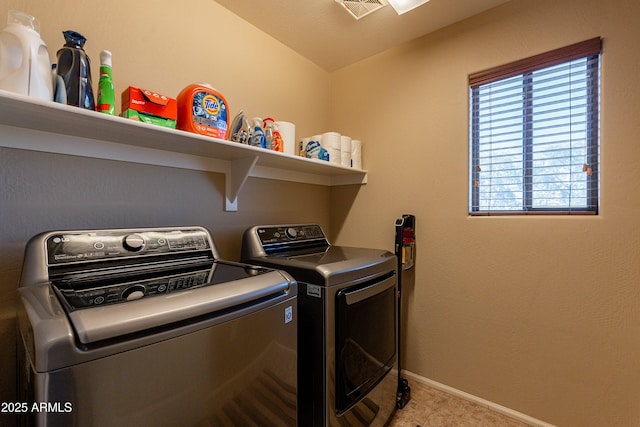 washroom with light carpet and washer and clothes dryer