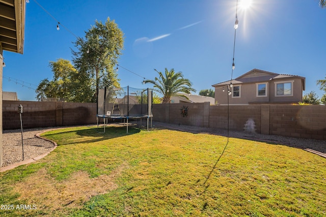 view of yard featuring a trampoline