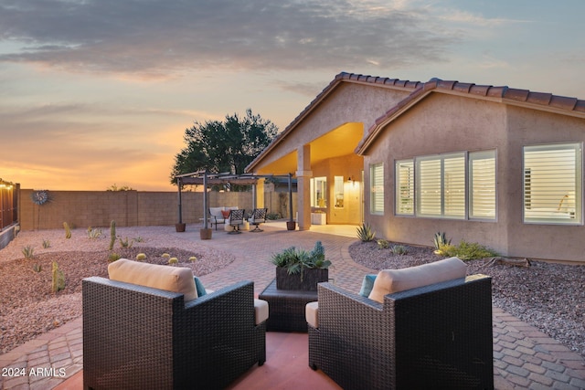 view of patio featuring an outdoor hangout area, a pergola, and a fenced backyard