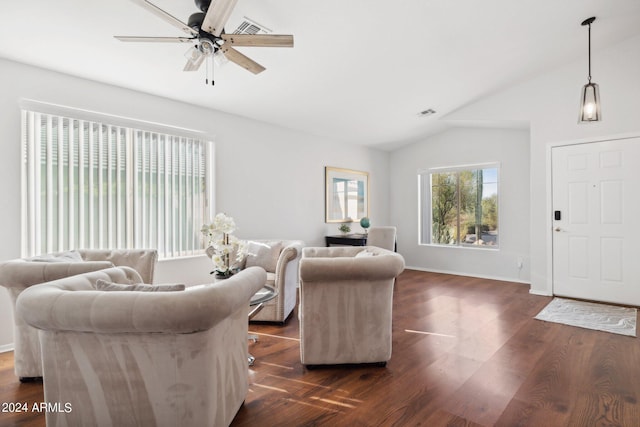 living area featuring ceiling fan, vaulted ceiling, dark wood finished floors, and baseboards