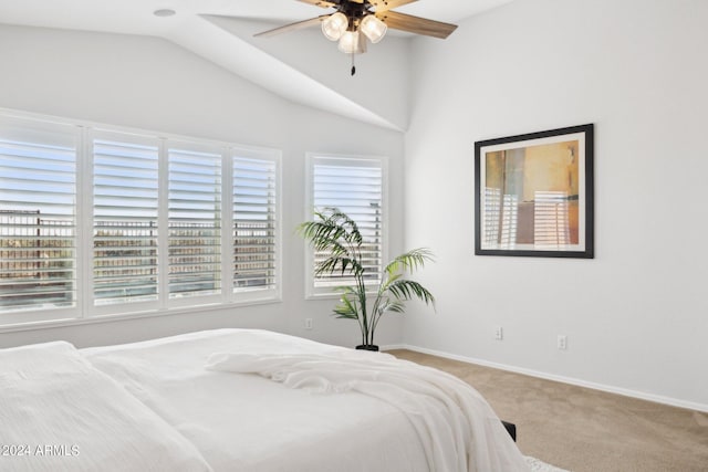 carpeted bedroom featuring multiple windows, lofted ceiling, baseboards, and ceiling fan