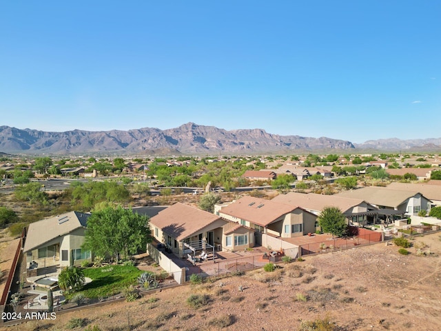 view of mountain background featuring nearby suburban area