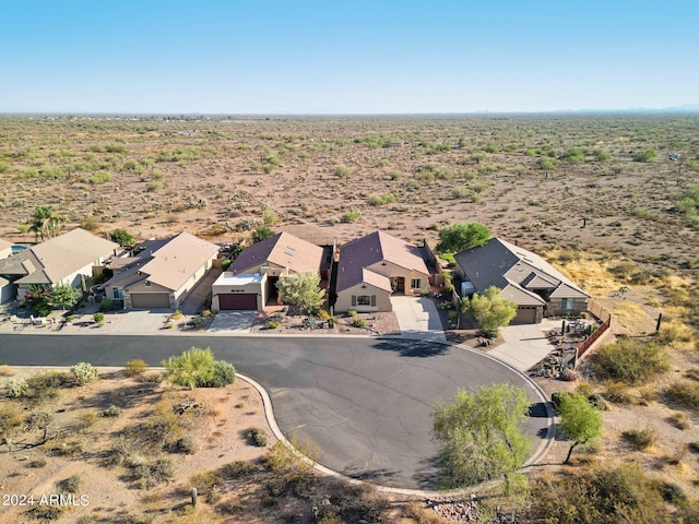 aerial view of residential area featuring a desert landscape