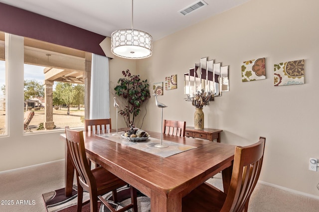 dining space with carpet floors