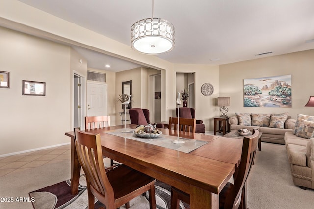 dining space with light carpet