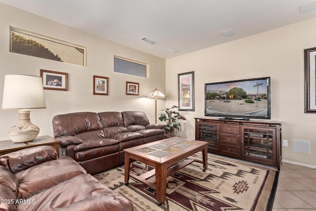 living room with light tile patterned flooring