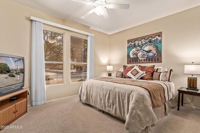 bedroom with ceiling fan and light colored carpet