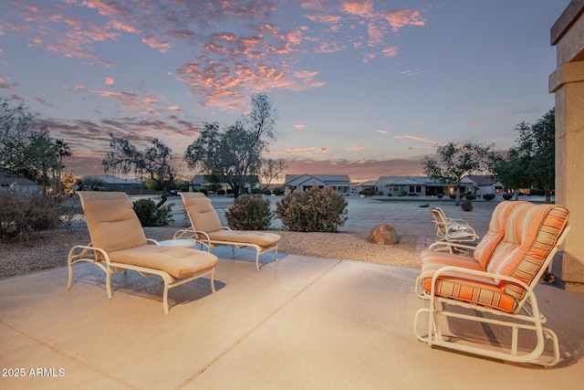 view of patio terrace at dusk