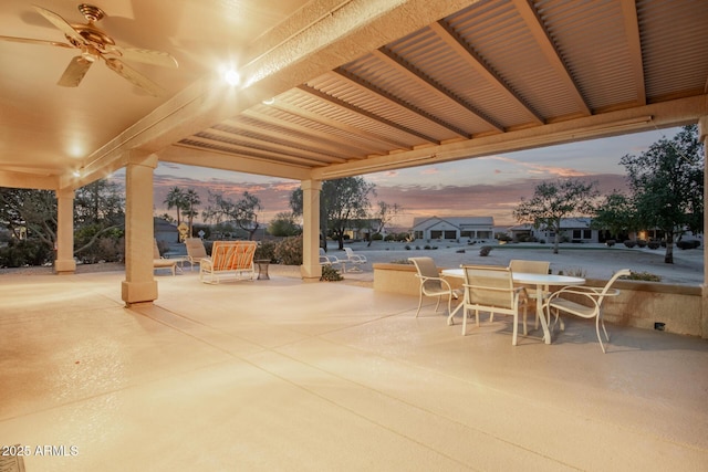 patio terrace at dusk with ceiling fan