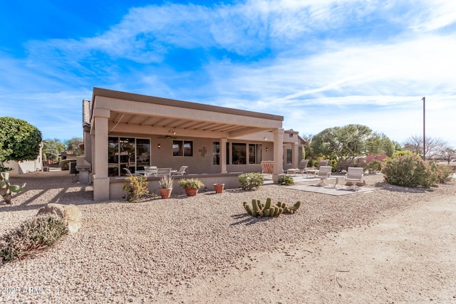 rear view of property featuring a patio area