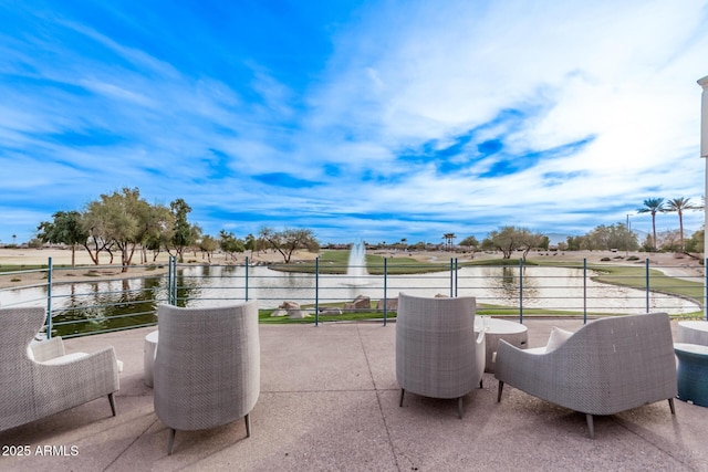 view of patio / terrace featuring a water view and a balcony