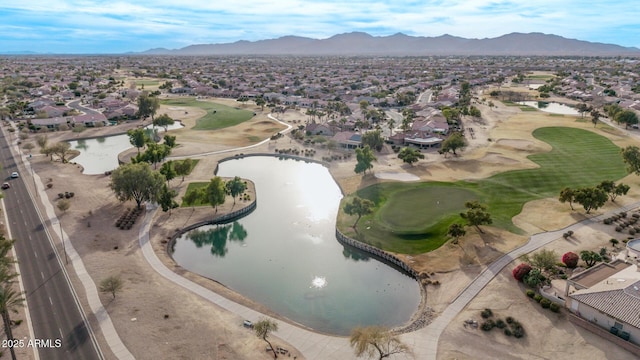 drone / aerial view with a water and mountain view