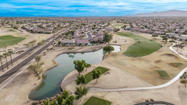 drone / aerial view with a water and mountain view