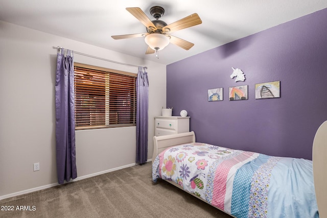 bedroom featuring ceiling fan and carpet