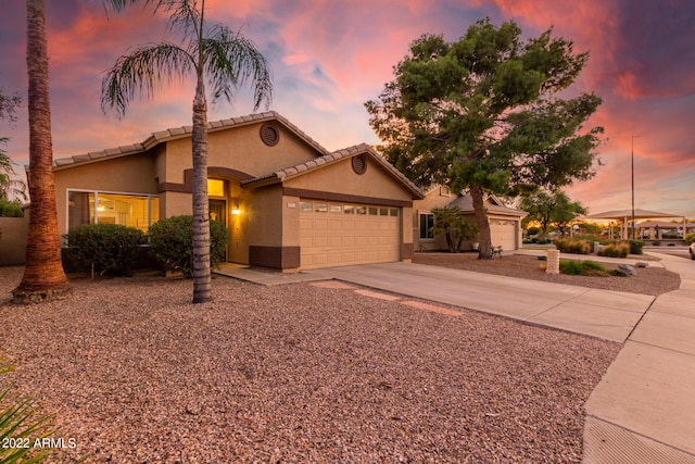 view of front of home with a garage